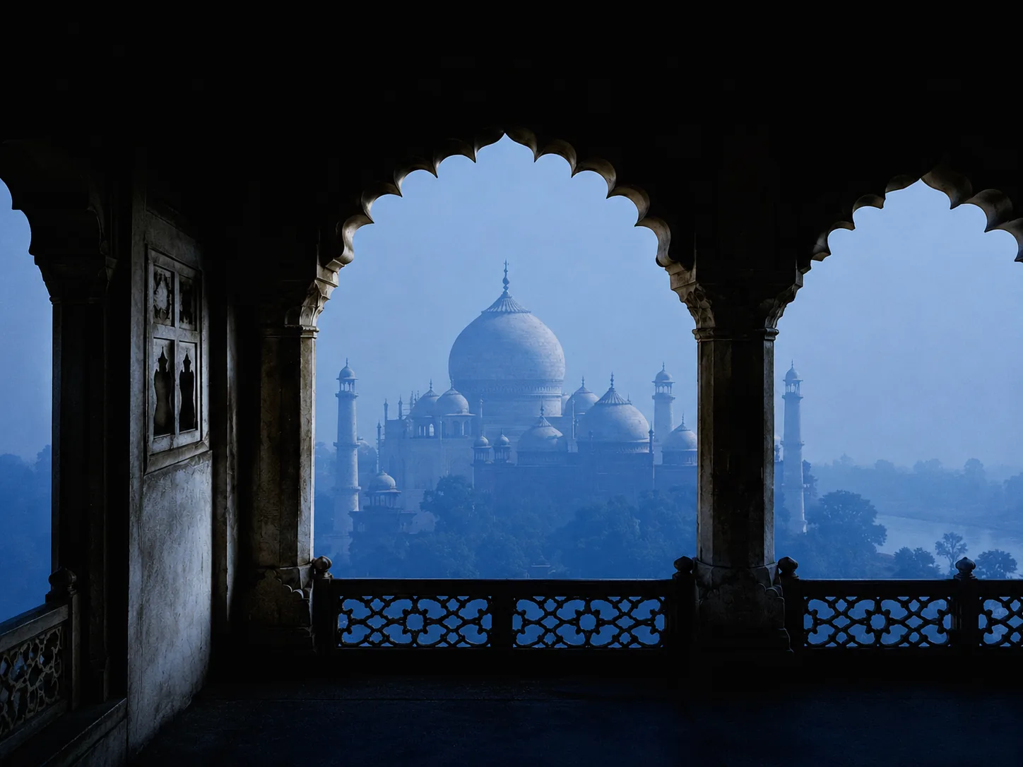 Taj Mahal framed by Mughal arches at dawn